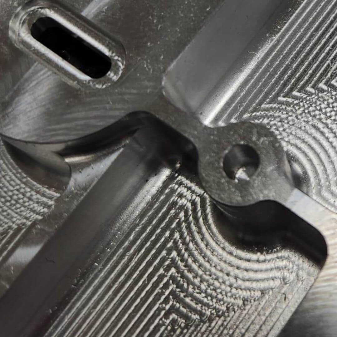 Precision-machined metal component with complex internal geometries used in thermal management and heat transfer applications.