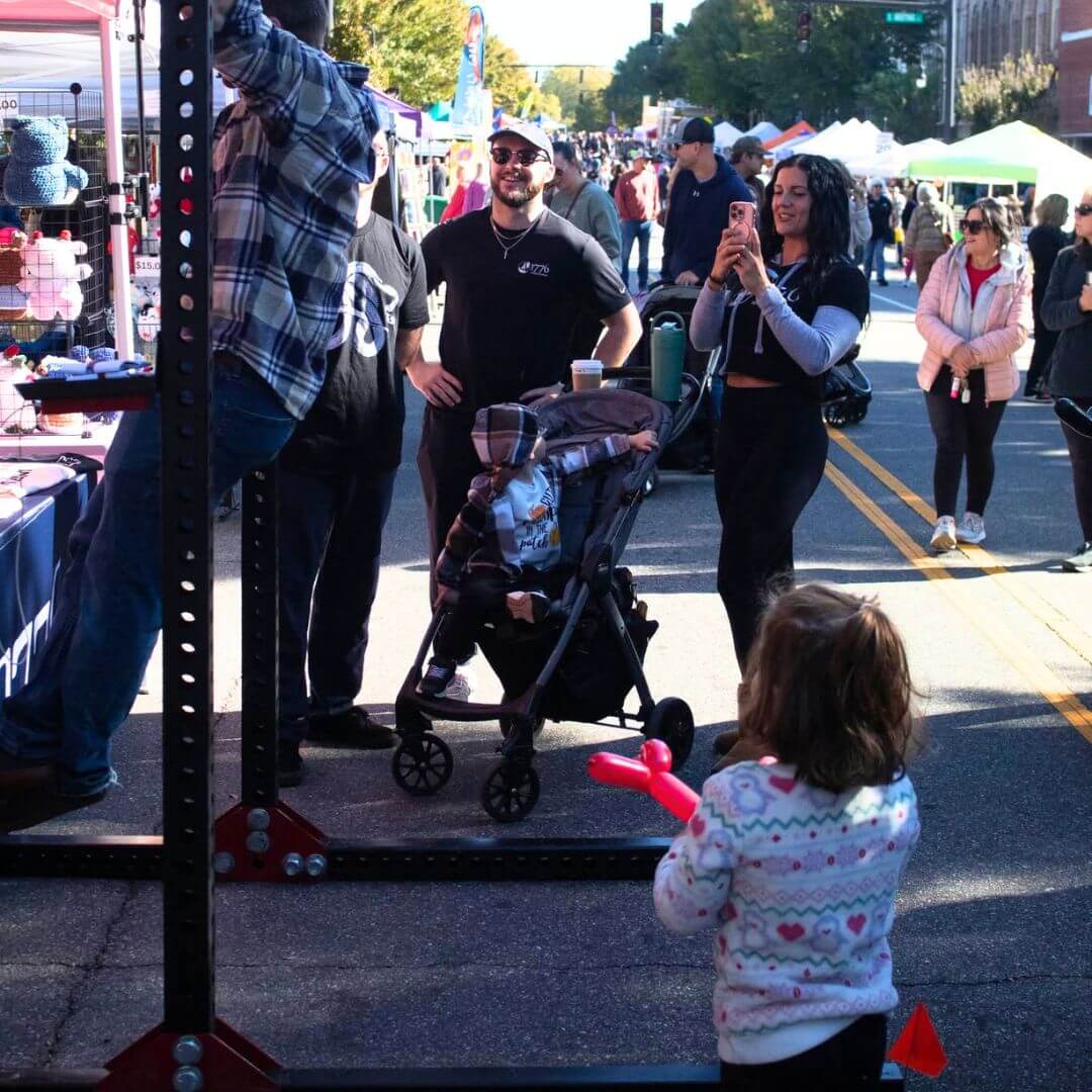 Families and residents enjoying a community street festival in downtown Statesville, North Carolina